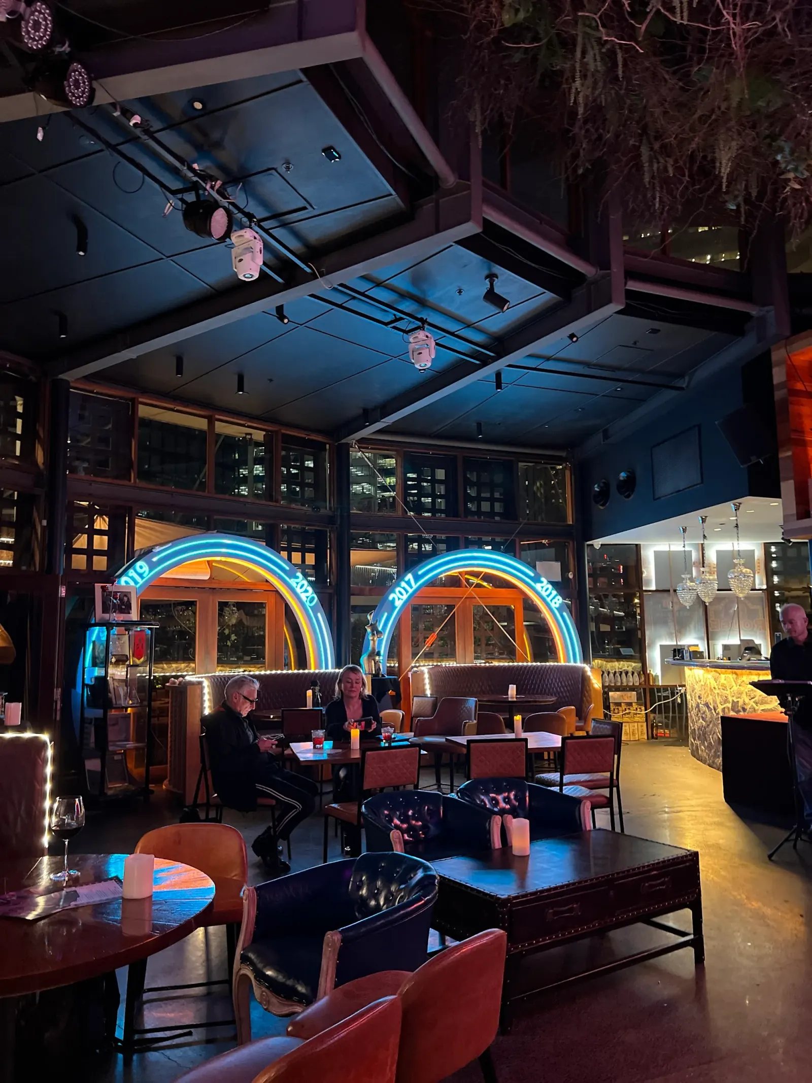 Interior lounge seating and neon-lit bar atmosphere at Rouge, Darling Harbour Sydney