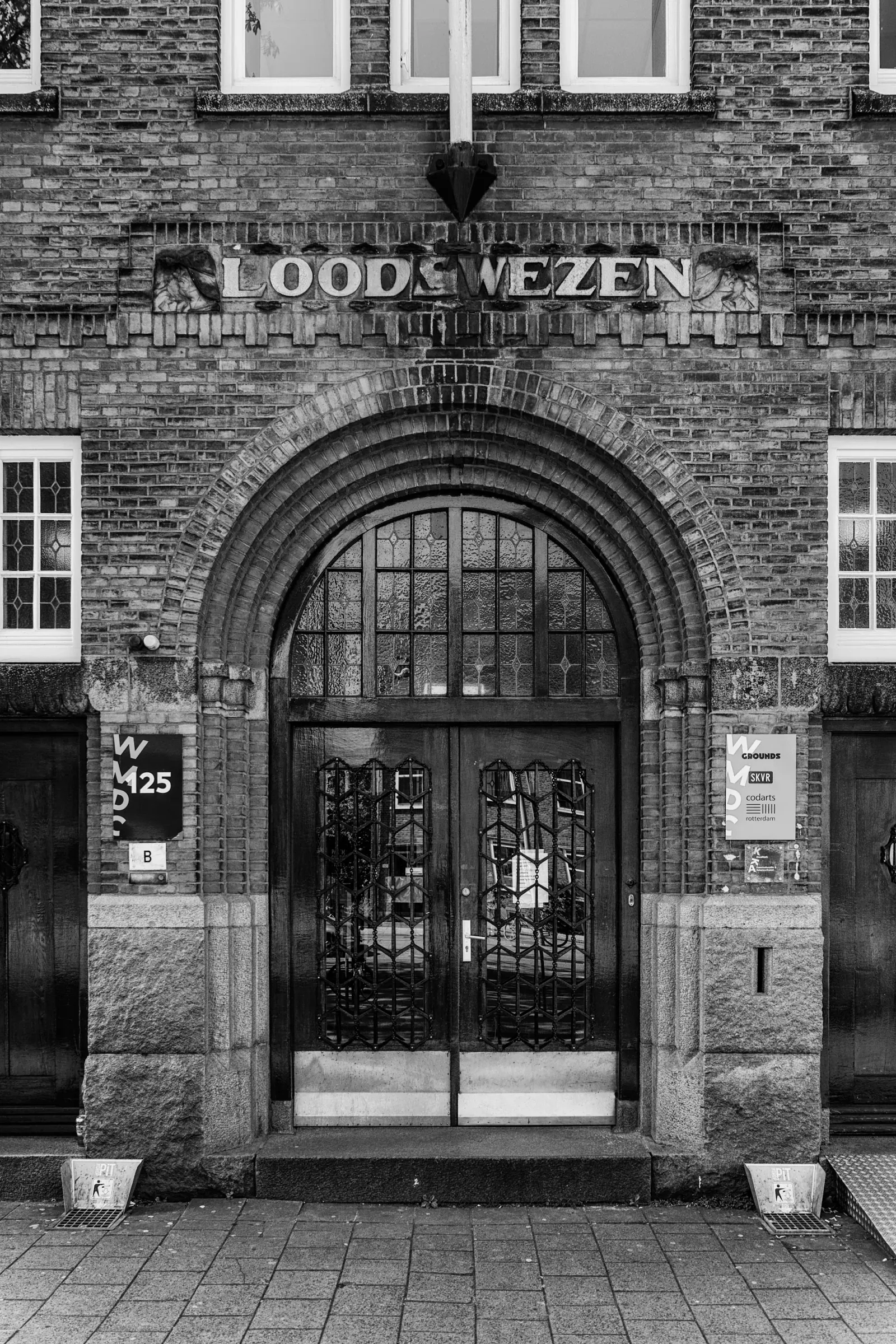Grounds Rotterdam historic Loodswezen entrance facade in black and white