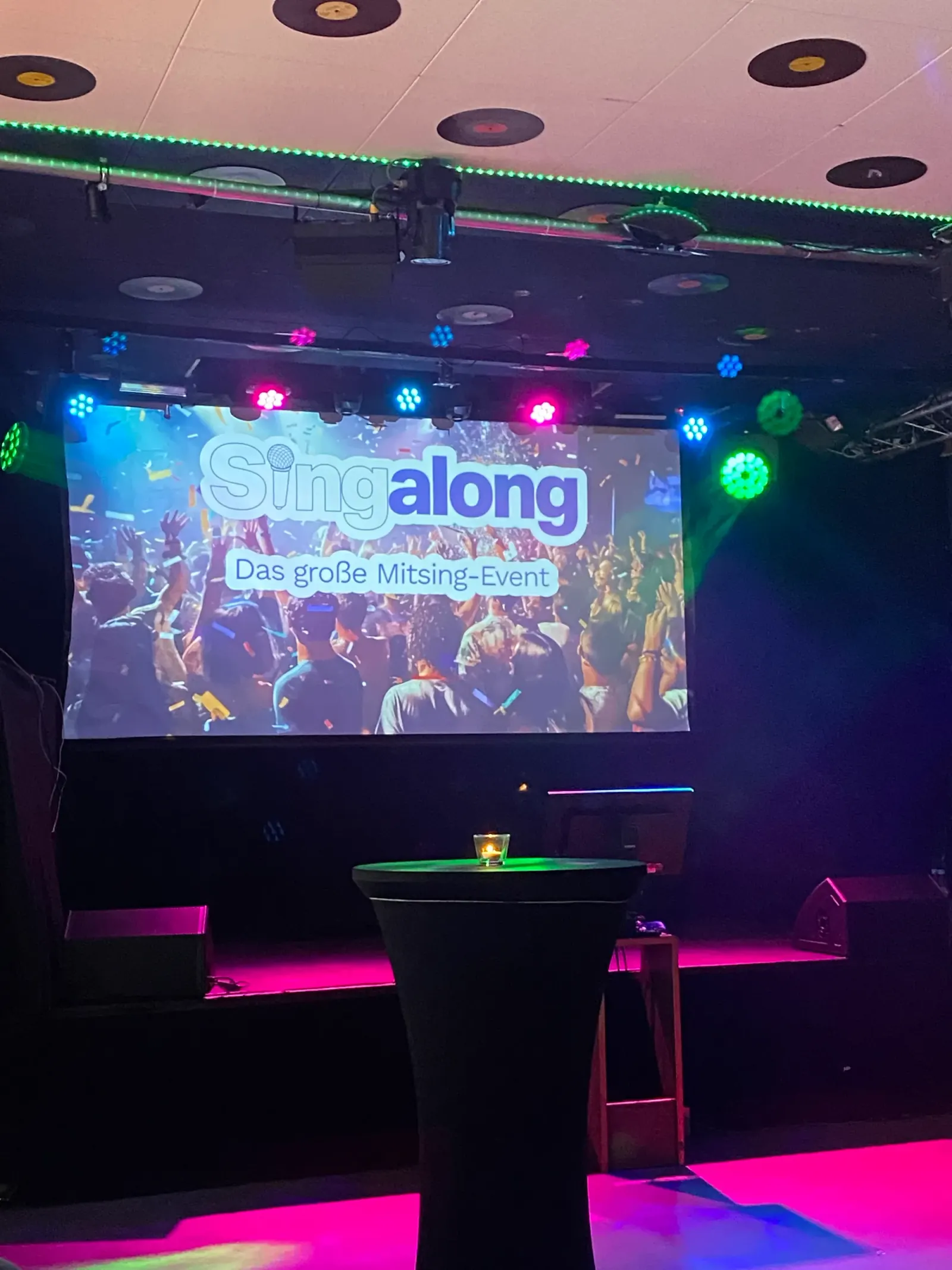 Stage with colored lights and DJ setup at Cascada Hamburg event venue