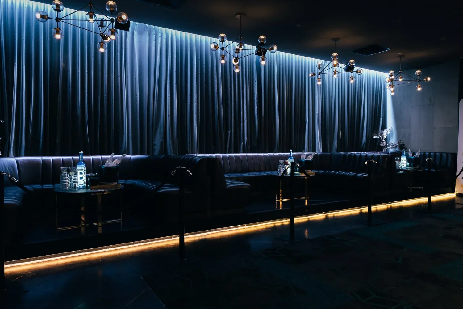 The Albion lounge seating with chandeliers and blue curtains at 172 York St South Melbourne