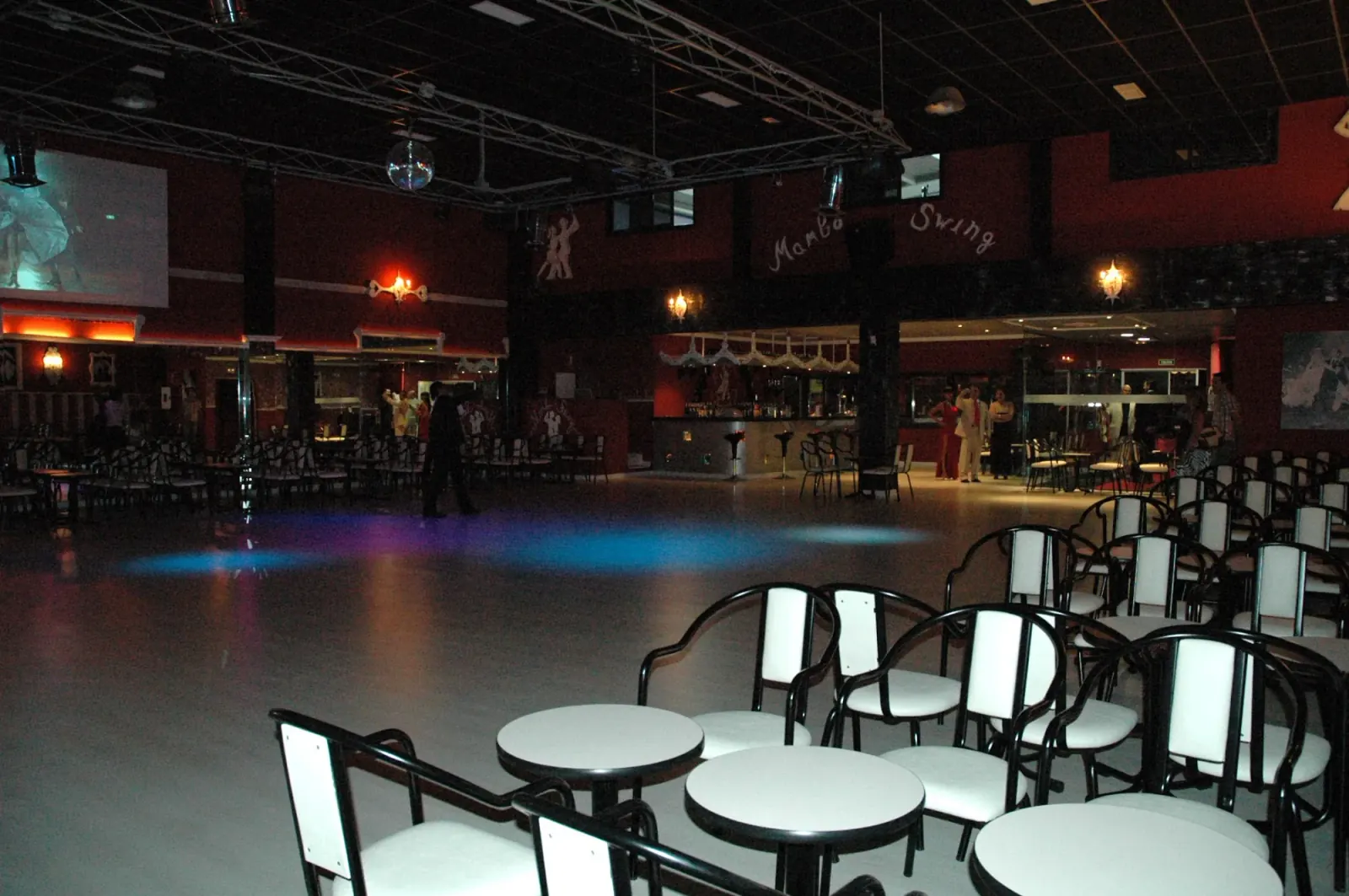 Mambo Swing dance hall interior with empty floor and branded wall signage in Madrid