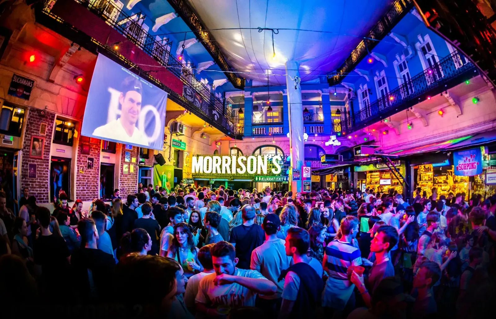 Outdoor courtyard at Morrison's 2 Klub Budapest packed with a night-time party crowd