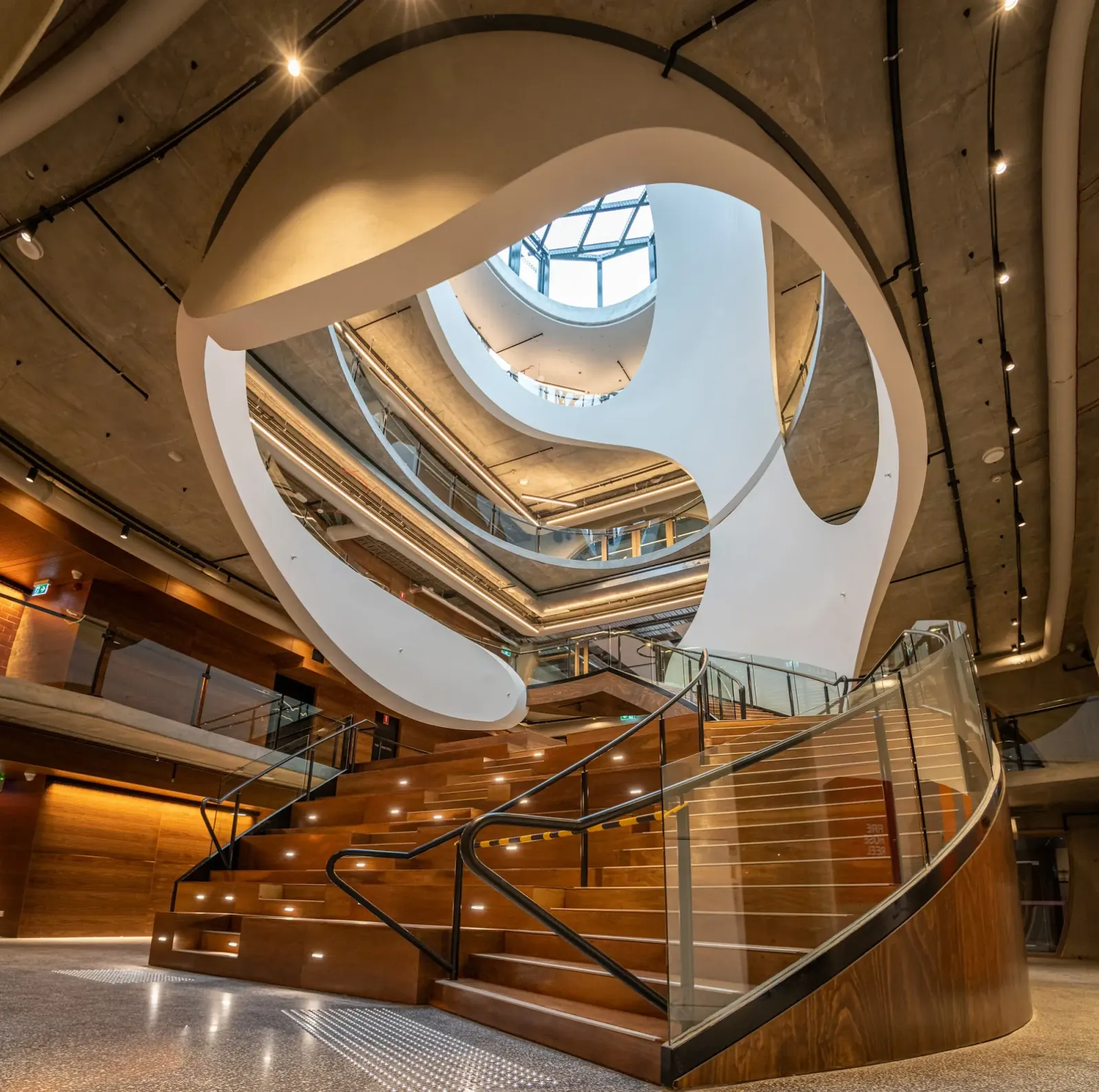 Dramatic spiral staircase atrium inside Victorian Pride Centre Melbourne