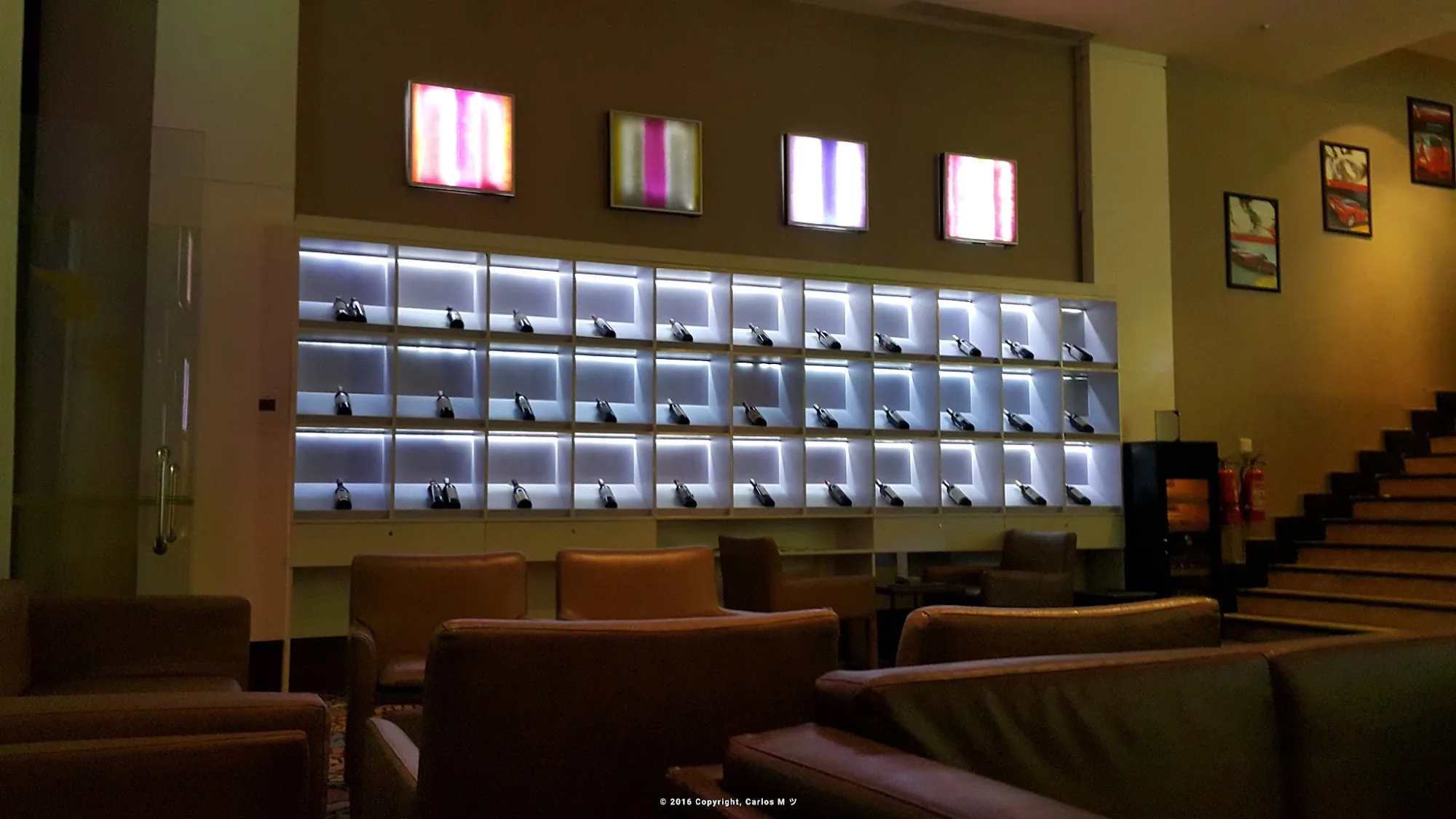 Blu Martini JW Marriott hotel lobby with illuminated display wall and lounge