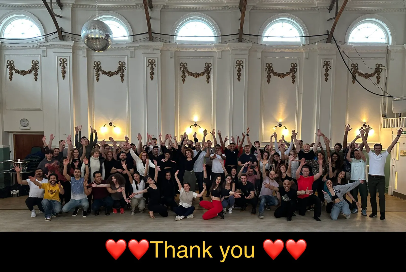 Group photo of salsa and bachata dancers inside Hammersmith Salsa & Bachata Club venue in London